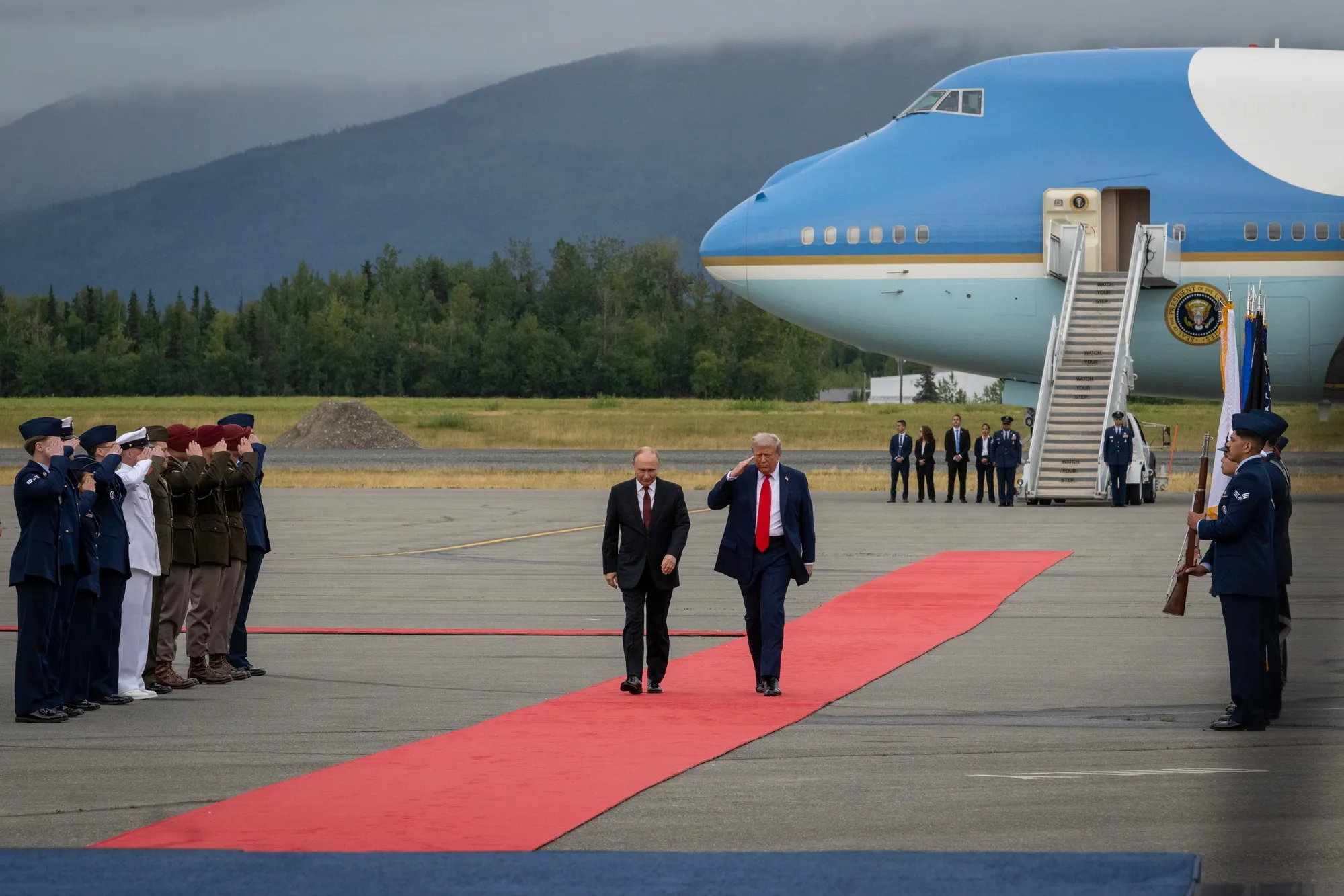 President Trump and Russian President Vladimir Putin walk down a red carpet at Joint Base Elmendorf-Richardson, Alaska, Aug. 15, 2025.