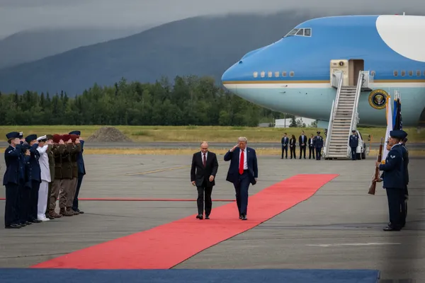 President Trump and Russian President Vladimir Putin walk down a red carpet at Joint Base Elmendorf-Richardson, Alaska, Aug. 15, 2025.