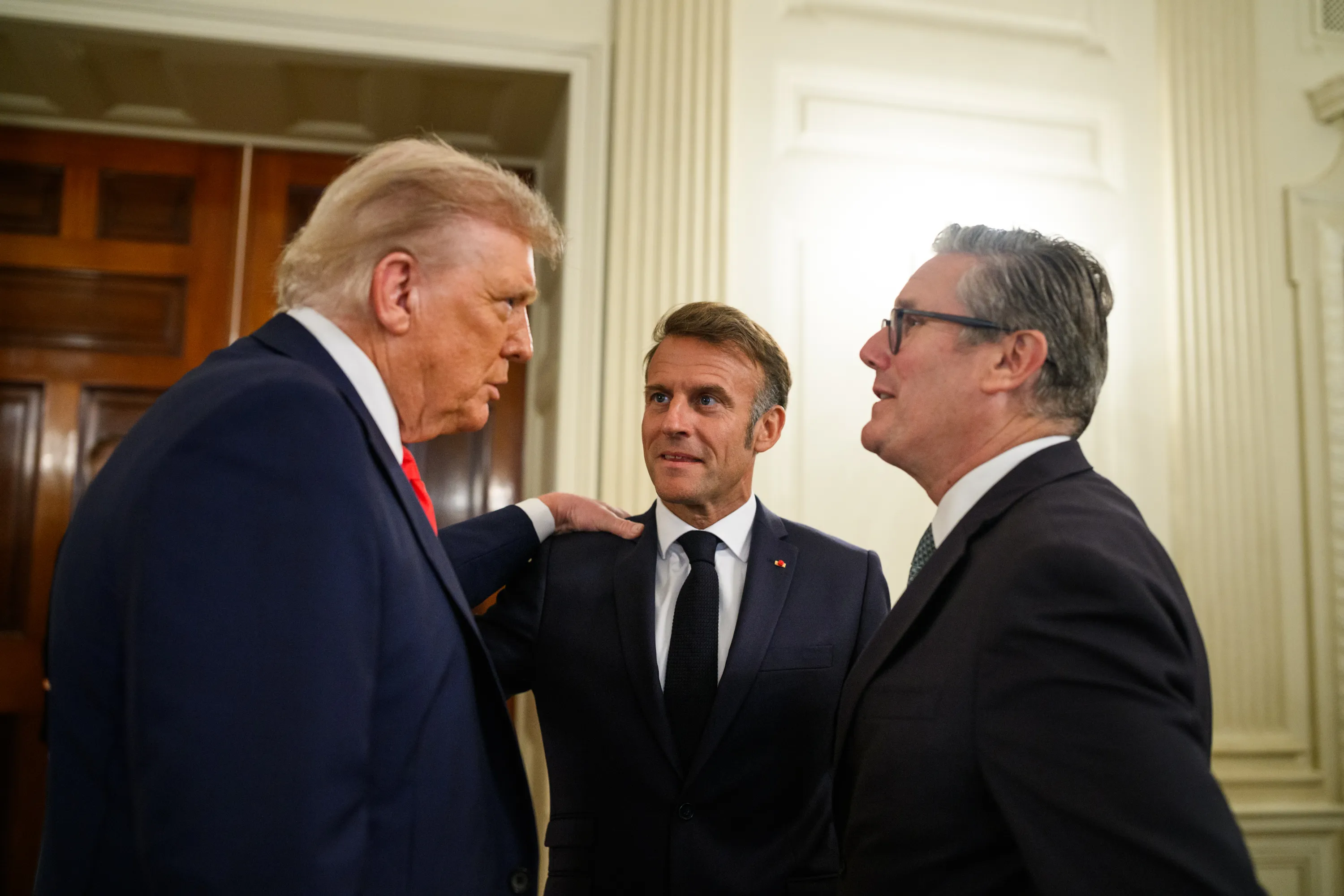 President Trump speaks with French President Emmanuel Macron and U.K. Prime Minister Keir Starmer in the State Dining Room of the White House, August 18, 2025.