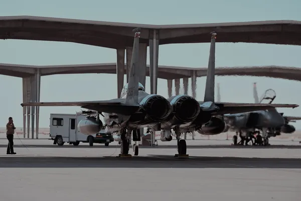 U.S. Air Force airman prepares an F-15E Strike Eagle to taxi the runway.