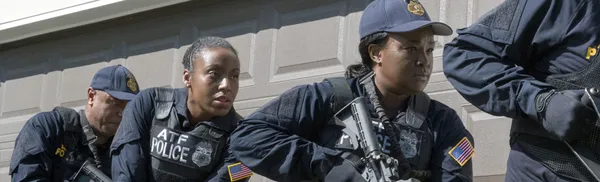 Armed federal agents during a tactical operation.